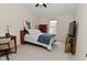 This cozy bedroom features neutral walls, vaulted ceilings, and a ceiling fan at 9477 Aberdare N Dr, Indianapolis, IN 46250