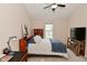 This bedroom features neutral walls, carpet, and a ceiling fan at 9477 Aberdare N Dr, Indianapolis, IN 46250