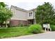 Charming two-story home with a brick and vinyl exterior, featuring a well-manicured lawn and mature trees at 9477 Aberdare N Dr, Indianapolis, IN 46250