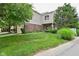 Charming two-story home with a brick and vinyl exterior, featuring a well-manicured lawn and mature trees at 9477 Aberdare N Dr, Indianapolis, IN 46250