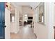 Bright foyer with wood floors, high ceilings, and a view into the living room and kitchen at 9477 Aberdare N Dr, Indianapolis, IN 46250