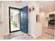 Bright entryway with views of an open-concept kitchen, featuring stainless steel appliances and modern finishes at 9477 Aberdare N Dr, Indianapolis, IN 46250
