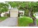 Attached garage and landscaped front yard with mature tree adding curb appeal to this lovely home at 9477 Aberdare N Dr, Indianapolis, IN 46250