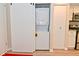 Washer and dryer are conveniently hidden behind a sliding barn door in the hallway at 9477 Aberdare N Dr, Indianapolis, IN 46250