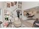 Open-concept living area with staircase, views of the kitchen, and lots of natural light at 9477 Aberdare N Dr, Indianapolis, IN 46250