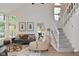 Comfortable living room features large windows, a fireplace, and modern decor at 9477 Aberdare N Dr, Indianapolis, IN 46250