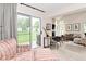 Bright living room featuring a sliding glass door to backyard and comfortable seating area at 9477 Aberdare N Dr, Indianapolis, IN 46250