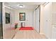 Convenient mudroom off the kitchen with stainless steel refrigerator and white cabinets, plus sliding door closet at 9477 Aberdare N Dr, Indianapolis, IN 46250