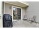 Inviting outdoor patio with seating, grill, and view to the interior at 9477 Aberdare N Dr, Indianapolis, IN 46250