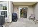 Cozy patio with outdoor seating, covered grill, and sliding glass door access at 9477 Aberdare N Dr, Indianapolis, IN 46250
