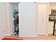 Pantry closet behind a sliding barn door provides ample space for cleaning supplies at 9477 Aberdare N Dr, Indianapolis, IN 46250