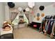 Versatile room filled with decorations and accessories, including hats and scarves at 10601 Adam Dr, Indianapolis, IN 46231