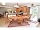 Sunny dining area adjacent to the kitchen with sliding door access to the outside at 10601 Adam Dr, Indianapolis, IN 46231