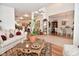 Bright, open floorplan with elegant furnishings, decor, wood and tile flooring, and lots of plants at 10601 Adam Dr, Indianapolis, IN 46231
