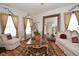 Cozy living room with decorative accents, natural light, wood flooring, and a large mirror at 10601 Adam Dr, Indianapolis, IN 46231