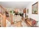 Inviting living space with fireplace, wood floors, staircase, and ample natural light at 10601 Adam Dr, Indianapolis, IN 46231