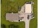 Aerial view of property with house, outbuilding, ample parking and driveway, perfect for living and storage at 10694 W Hickory Ct, Quincy, IN 47456