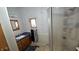 This efficient bathroom with a stand-up shower is a functional and private space at 10694 W Hickory Ct, Quincy, IN 47456