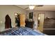 Cozy bedroom features a ceiling fan and closet for ample storage space at 10694 W Hickory Ct, Quincy, IN 47456