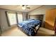 Relax in a cozy bedroom with natural light, providing a tranquil retreat for rest and rejuvenation at 10694 W Hickory Ct, Quincy, IN 47456