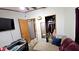Bedroom showcasing a closet, neutral carpet, and doorway to another room at 10694 W Hickory Ct, Quincy, IN 47456