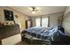 The main bedroom provides a comfortable space with great natural light and ample room for furniture at 10694 W Hickory Ct, Quincy, IN 47456