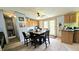 A functional dining area offers an inviting space for meals, complemented by ample natural light at 10694 W Hickory Ct, Quincy, IN 47456