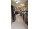 An efficient kitchen features wood cabinets and modern appliances to make cooking easy and convenient at 10694 W Hickory Ct, Quincy, IN 47456