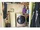 Laundry area featuring a new washer and dryer, offering convenience and efficiency at 10694 W Hickory Ct, Quincy, IN 47456
