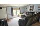 Comfortable living room boasts a large window and plush seating at 10694 W Hickory Ct, Quincy, IN 47456