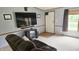 Relaxing living room offers a comfortable couch, TV, and natural light at 10694 W Hickory Ct, Quincy, IN 47456