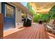 Inviting back deck features a grill, seating area, wooden railing, and shade covering for outdoor entertaining at 11059 W Old Nashville Rd, Columbus, IN 47201