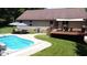 Backyard featuring a private in-ground pool with comfortable seating and a grilling area at 11059 W Old Nashville Rd, Columbus, IN 47201