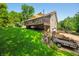 Expansive deck with awning offers ample space for relaxation, and the lush lawn adds a touch of natural beauty to the outdoor area at 11059 W Old Nashville Rd, Columbus, IN 47201