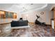 Finished basement features a seating area, exercise equipment, and a large window for natural light at 11059 W Old Nashville Rd, Columbus, IN 47201