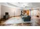 Open-concept finished basement with seating area, exercise equipment, bar, and exterior door at 11059 W Old Nashville Rd, Columbus, IN 47201
