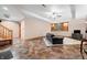 Spacious finished basement with staircase, sofa, television, and exercise equipment at 11059 W Old Nashville Rd, Columbus, IN 47201