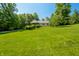 Spacious home with a beautifully manicured lawn and mature trees at 11059 W Old Nashville Rd, Columbus, IN 47201