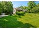 Beautifully landscaped home with a well-maintained lawn and a charming covered porch at 11059 W Old Nashville Rd, Columbus, IN 47201