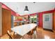 Kitchen and Dining Area, with stainless steel appliances, wood cabinets and views to the backyard at 11059 W Old Nashville Rd, Columbus, IN 47201