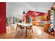 Spacious kitchen with stainless steel appliances, wooden cabinets, and seamless flow to the living area at 11059 W Old Nashville Rd, Columbus, IN 47201