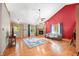 Cozy living room with a brick fireplace, hardwood floors, and ample natural light at 11059 W Old Nashville Rd, Columbus, IN 47201