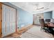 Bright office offers a ceiling fan, exterior door, and space for dual monitors at 11059 W Old Nashville Rd, Columbus, IN 47201