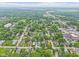 Residential area with green trees, houses, and commercial areas at 113 N Munsie St, Indianapolis, IN 46229