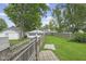 Fenced backyard featuring a detached garage and well-maintained lawn at 113 N Munsie St, Indianapolis, IN 46229