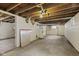 Spacious unfinished basement with concrete floor and exposed ceiling at 113 N Munsie St, Indianapolis, IN 46229