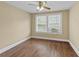 Bedroom featuring vinyl floor, ceiling fan and double-hung windows at 113 N Munsie St, Indianapolis, IN 46229