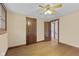 Bedroom showcasing hardwood floors, classic trim, and two wooden doors at 113 N Munsie St, Indianapolis, IN 46229