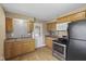 Spacious kitchen with stainless steel appliances and updated cabinets at 113 N Munsie St, Indianapolis, IN 46229