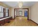 Open concept living room with hardwood floors, natural light, and neutral paint palette at 113 N Munsie St, Indianapolis, IN 46229